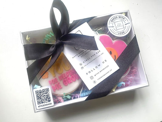 Baked goods in packaging with a custom QR code sticker in the bottom right and company name below, showing small business branding and interactive packaging