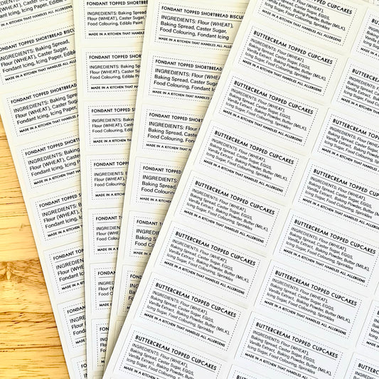 Set of ingredient labels featuring text, arranged on wooden surface