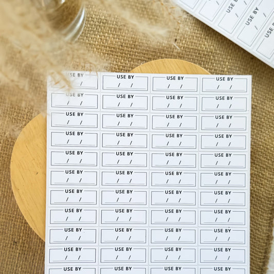 Minimalist black and white ‘Use By’ stickers for food products