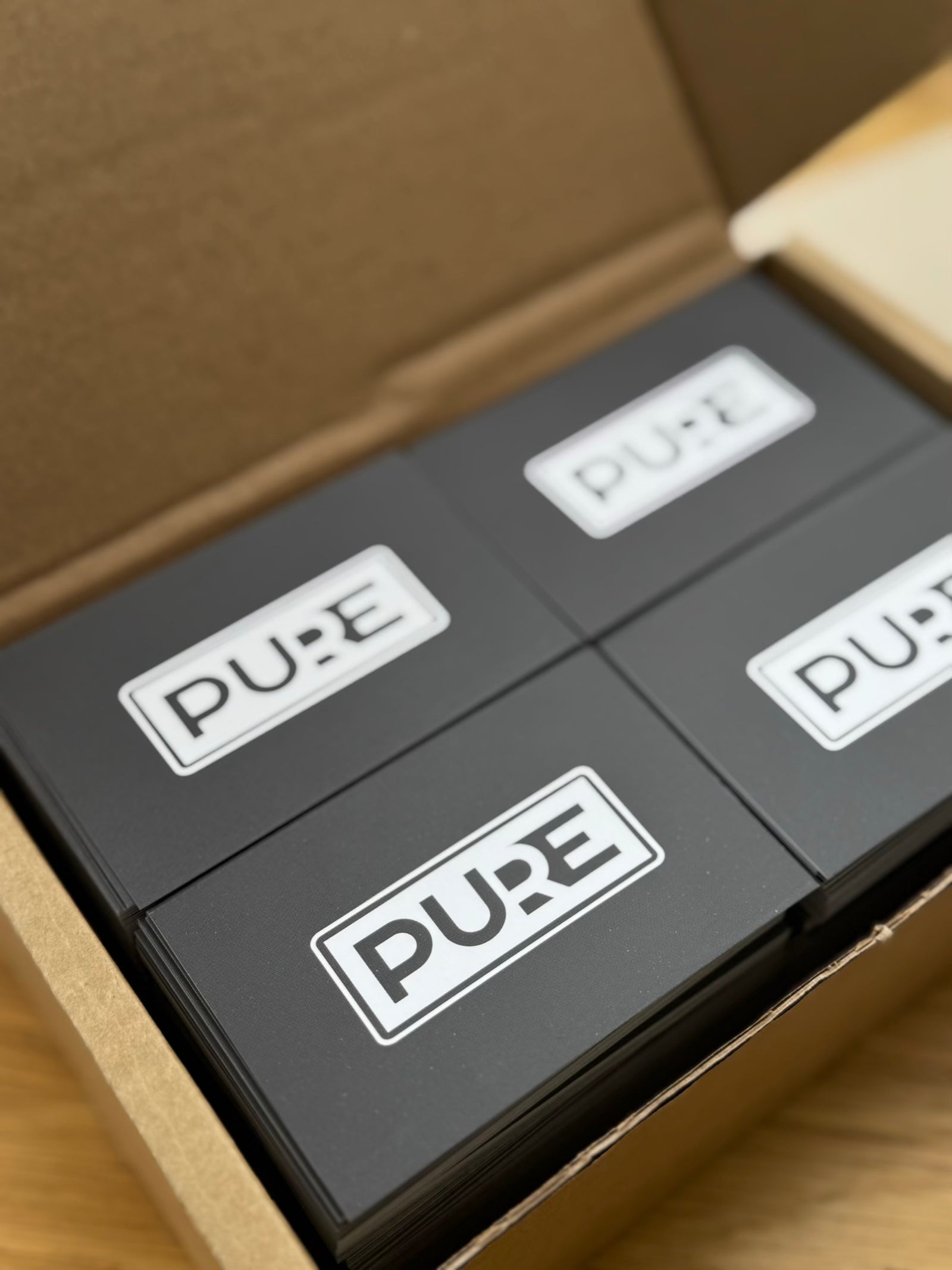 Branded product packaging with custom logo stickers