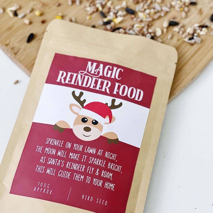 Single kraft pouch of Magic Reindeer Food on a wooden board