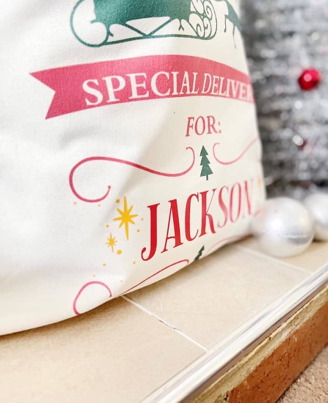 Close-up of the Special Delivery for Jackson print on a cream Santa sack