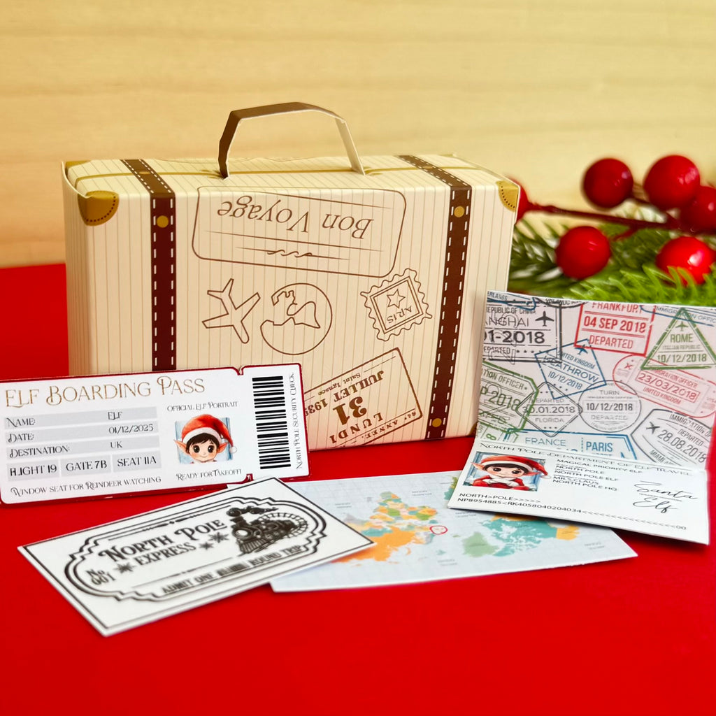 Mini paper toy suitcase ‘Bon Voyage’ with elf travel-themed cards on red background