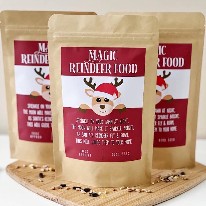 Three kraft pouches of Magic Reindeer Food with a cartoon reindeer label