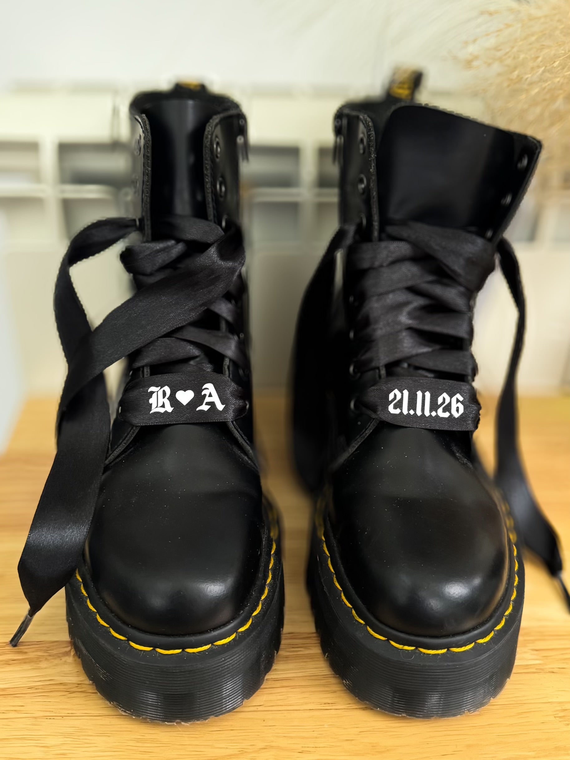 Black satin personalised wedding shoelaces with initials & date. Perfect for Dr. Martens boots, adding a stylish bridal touch.