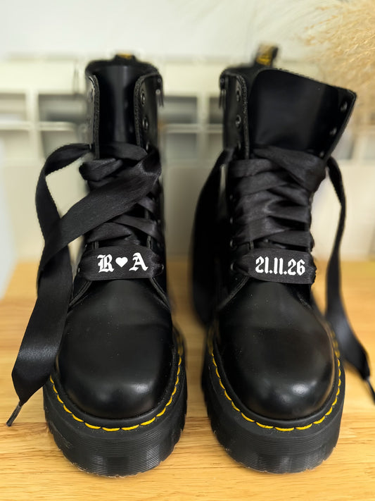 Black satin personalised wedding shoelaces with initials & date. Perfect for Dr. Martens boots, adding a stylish bridal touch.