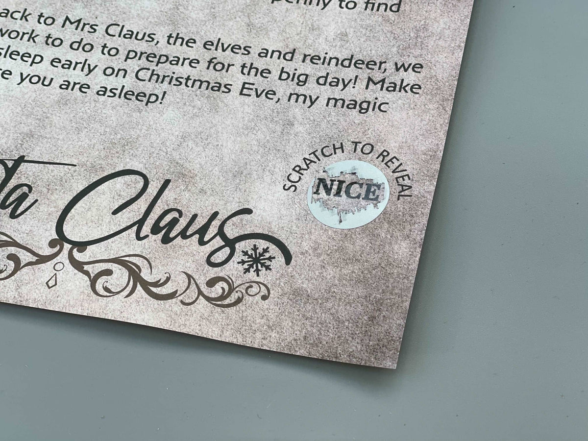 Close-up of Santa's signature and the scratch-to-reveal Nice sticker