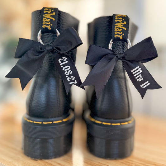 Personalised black wedding boot bows with white personalisation