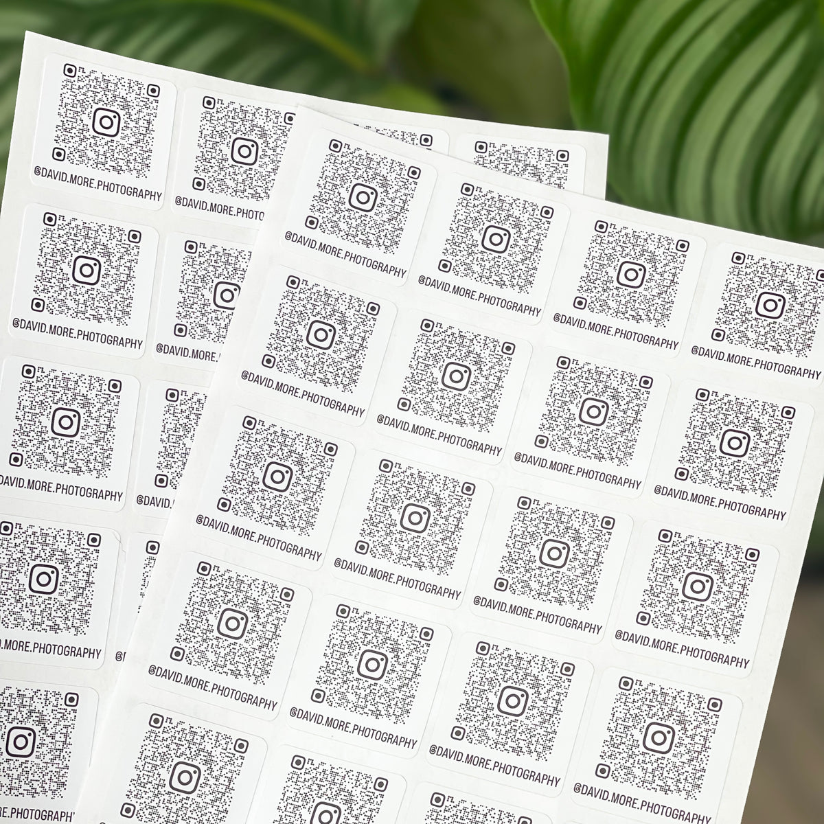 Personalised QR code stickers linking to Instagram, Linktree or review pages