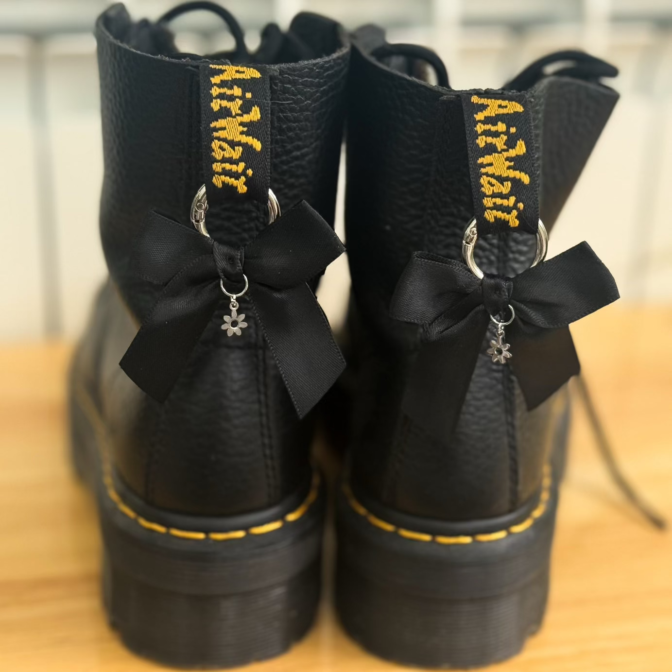 Black boots with bows with daisy charm