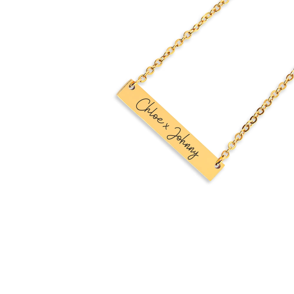 A personalised necklace in the shape of a horizontal bar. Text in the centre of the bar. Gold Silver or Rose Gold plated.