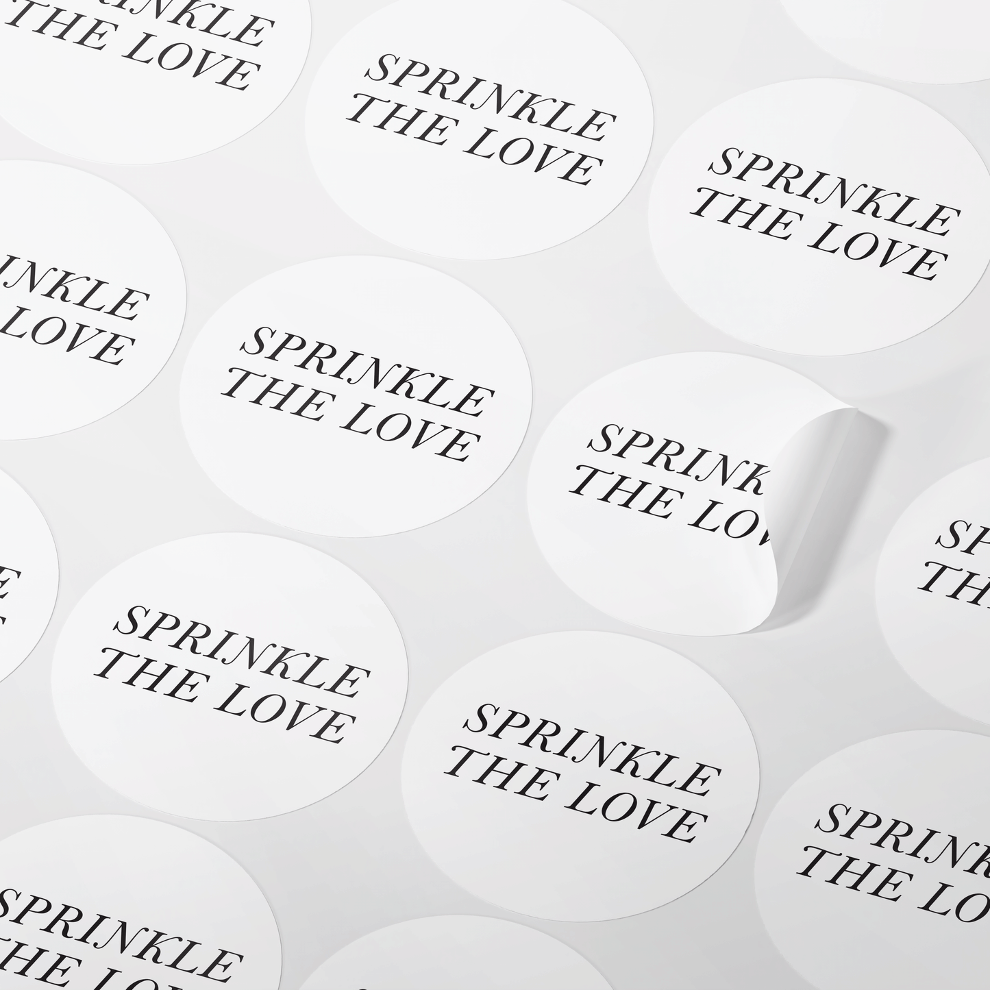 Minimalistic wedding confetti stickers with "Sprinkle The Love" in black text on a white background, available in glossy and matte finish.